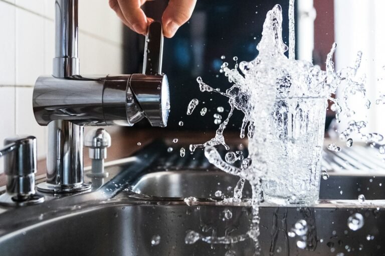 person opening faucet