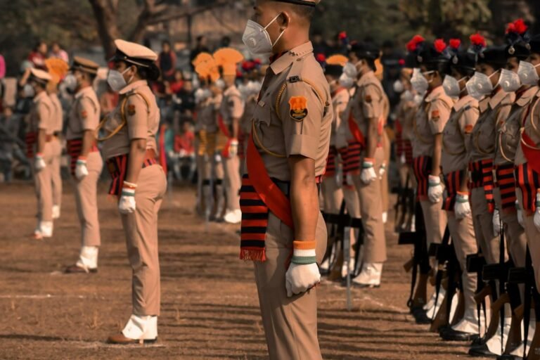 soldiers in brown uniform standing on brown field during daytime